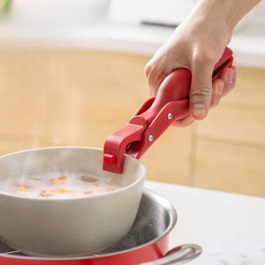 Anti-scald bowl gripper lifting a hot ceramic bowl