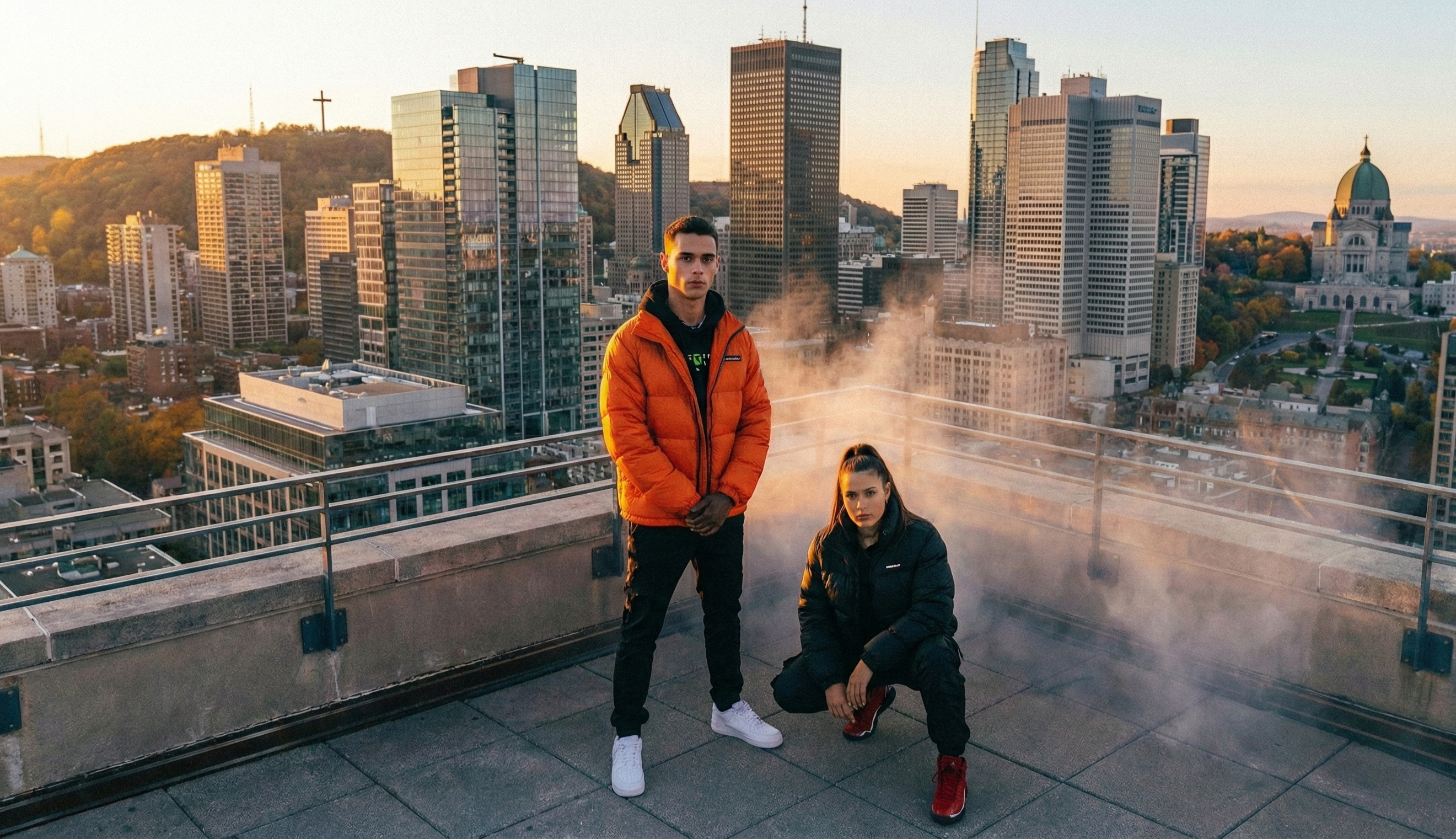 Two people on a rooftop with city skyline in the background