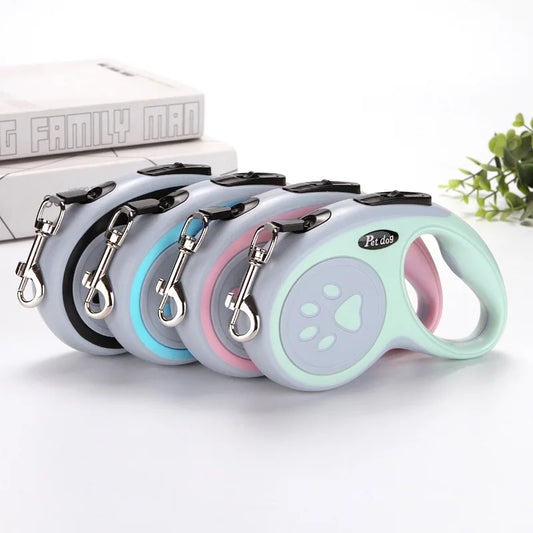 Retractable dog leash in pink with ergonomic grip